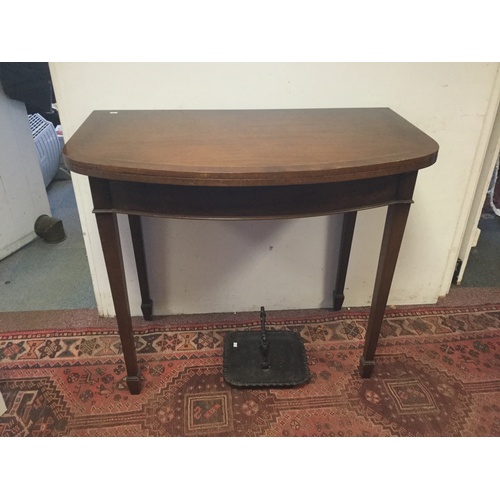 320 - A mahogany, line inlaid and crossbanded fold-over tea table, with swivel action, on square tapering ... 