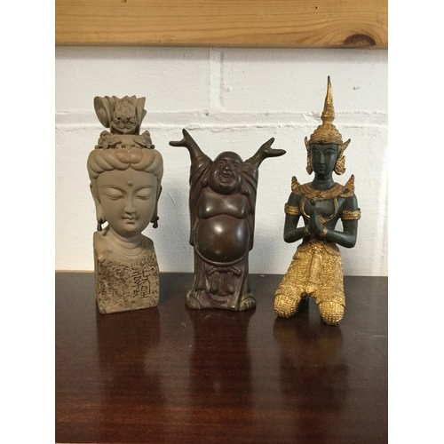 308 - A bronze Buddha, together with other figures -