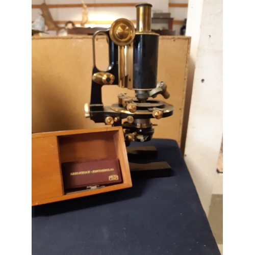 312 - A Carl Zeiss Jena microscope, numbered 50816, in case with accessories -