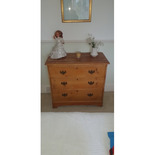 329 - A late 19th century pine chest, fitted with three drawers -
