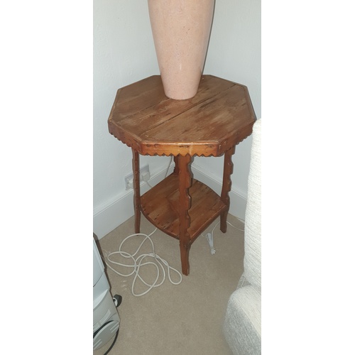 338 - A pine occasional table, with octagonal top and carved legs, to shaped undertier -