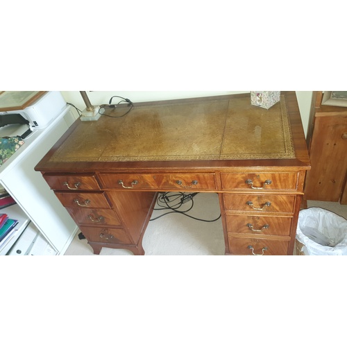 340 - A pedestal desk, with inset top over three frieze drawers and drawers to each pedestal -