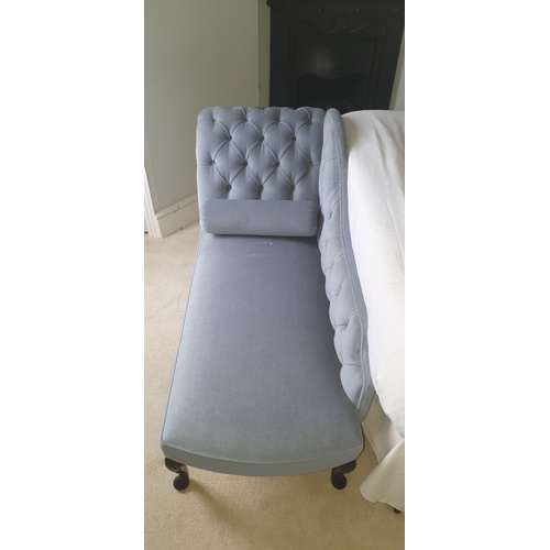 344 - A reproduction chaise longue, with buttoned arm and back, on short cabriole legs -