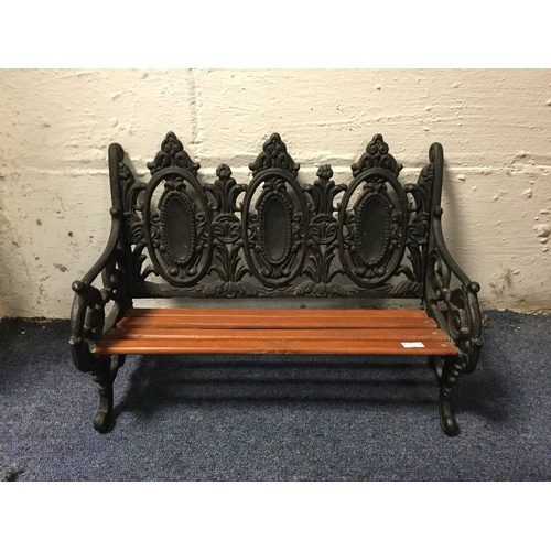 346 - A cast iron dolls bench -
