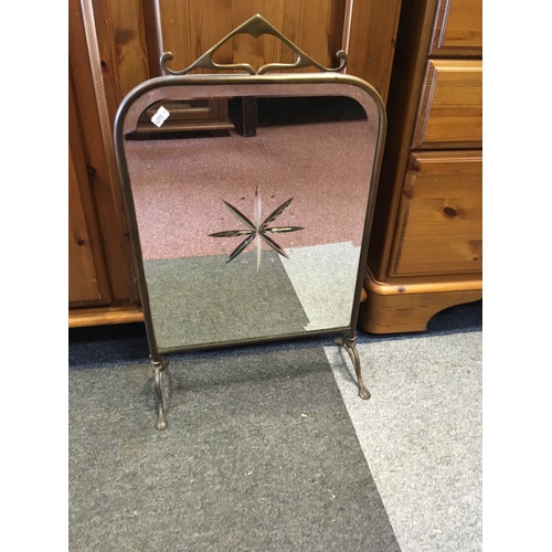 351 - A brass framed firescreen, with mirrored panel -