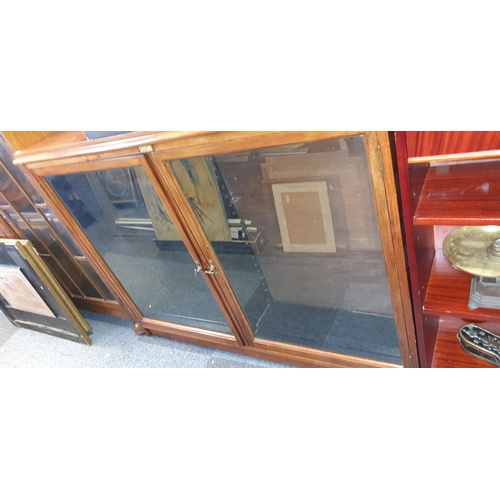 352 - An early 20th century display cabinet, with two glazed doors, labelled for Griffiths Bros Ltd, Shopf... 