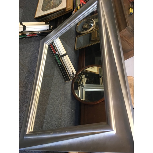 353 - A large wall mirror, in silver coloured frame -