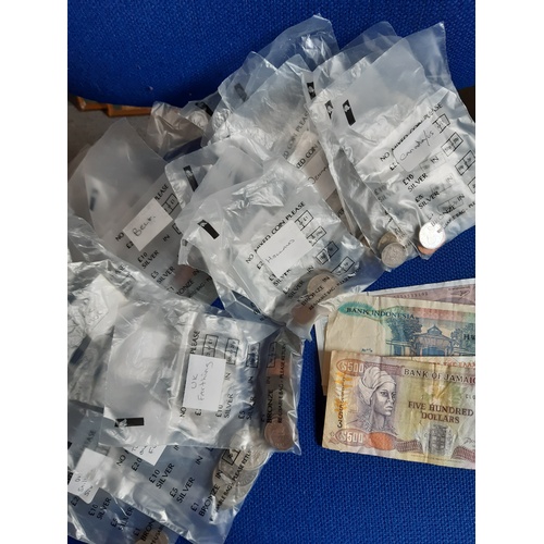 228A - A quantity of assorted coins and banknotes -