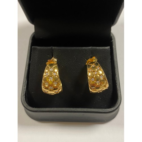 2 - A pair of 18ct gold earrings, set with diamonds (one diamond deficient) -