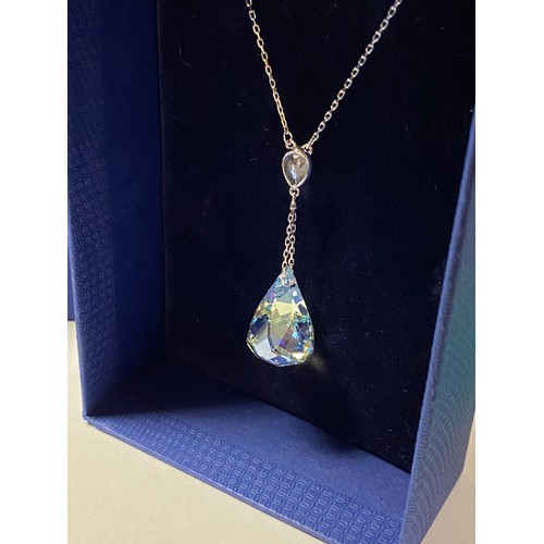 34 - A Swarovski necklace, with faceted triolette drop, boxed, another Swarovski necklace and earrings (2... 