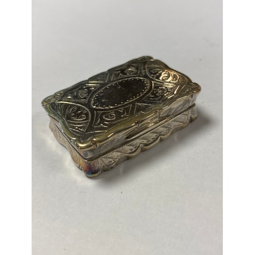 39 - A mid Victorian silver vinaigrette, George Unite, Birmingham 1875, with shaped and engraved case and... 