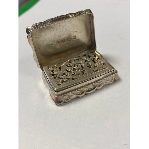 39 - A mid Victorian silver vinaigrette, George Unite, Birmingham 1875, with shaped and engraved case and... 