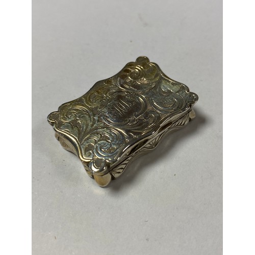 44 - A Victorian silver vinaigrette, Edward Smith, Birmingham, the case of shaped outline and decorated w... 