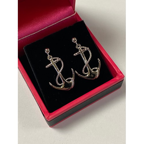 54 - A pair of silver ear pendants, each designed as an anchor -