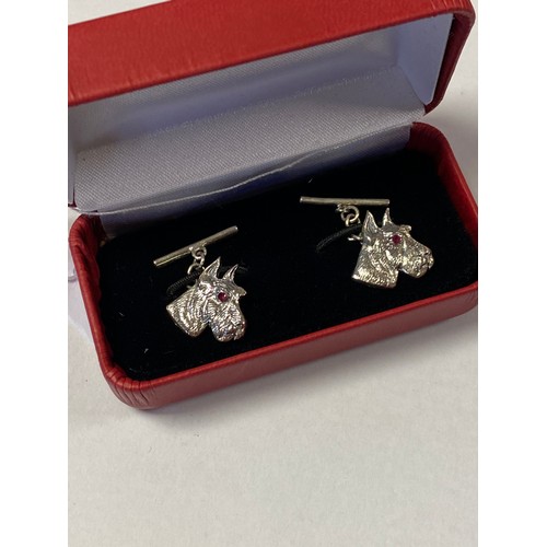 59 - A pair of silver cufflinks, each designed as a terriers head -