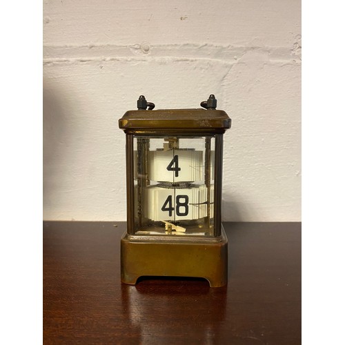 305 - A brass cased flicker/ticker style clock -