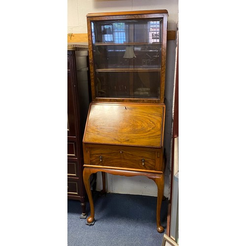 308 - A walnut veneered bureau bookcase, of small size, with glazed top over fall front, single drawer and... 