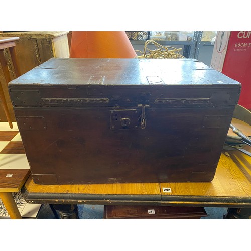 390 - A metal bound trunk, with side carry handles -