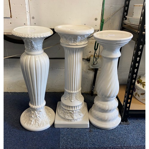 303 - Three white glazed pot stands -