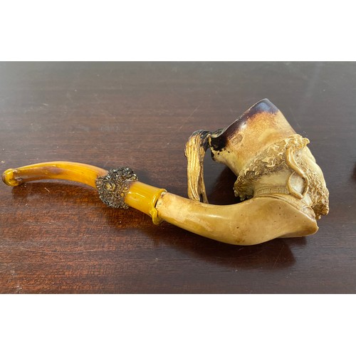 122 - A Meerschaum pipe, carved as a male head, with amber mouthpiece, together with three other pipes (4)... 