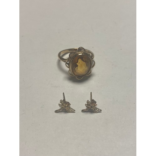 19 - A 9ct gold ring, set with an oval citrine, together with a pair of gold earrings -