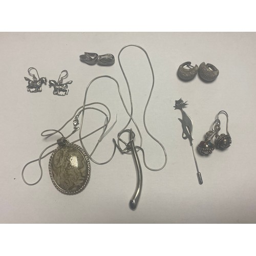 26 - A small group of silver and costume jewellery items, including two pendants on chains, earrings etc ... 