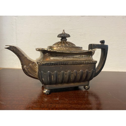 42 - A late Victorian silver bachelor's teapot, London 1888, with half gadrooned body, ebony handle and l... 