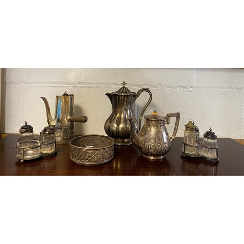 46 - A small quantity of silver plated wares, to include bottle coaster, cruets, chocolate pot etc -