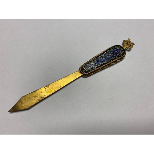 135 - An Italian micromosaic letter opener, surmounted by St Mark's lion, the handle inset with floral dec... 