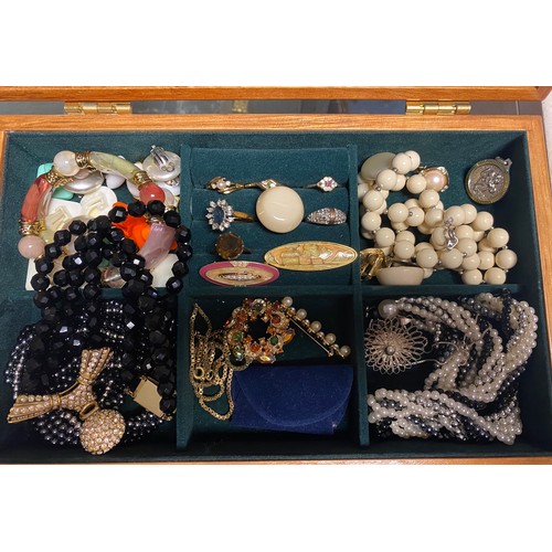 85 - A quantity of costume jewellery, in two cases -