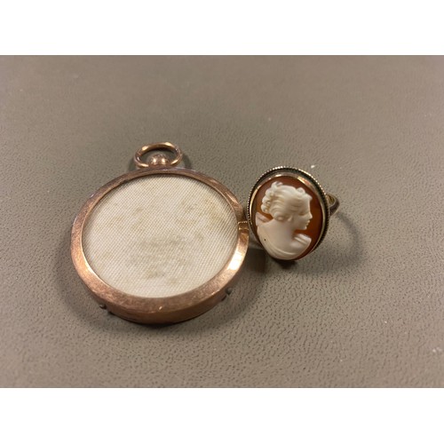 6 - A 9ct gold cameo ring, the shell carved with the profile of a lady, in 9ct mount and a locket pendan... 