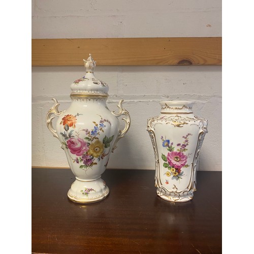 67 - A continental pot pourri vase, urn shaped and with flame finial to pierced cover, painted with flowe... 