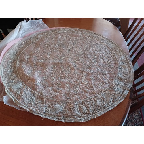 60 - A large circular Middle Eastern hand embroidered tablecloth -