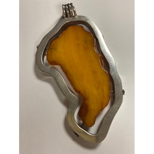 7 - A large modern amber pendant,  silver frame mount -