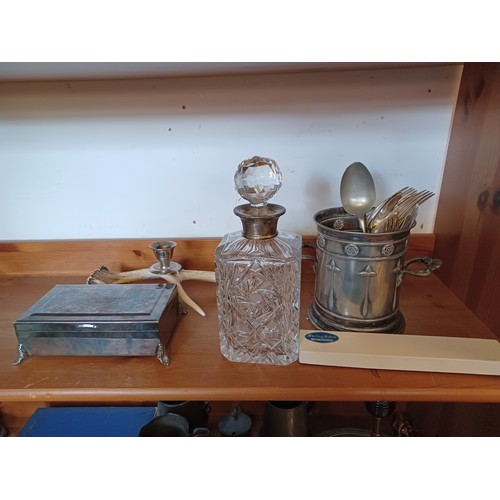 31 - A silver collared decanter, together with a plated champagne coaster and other platedwares -