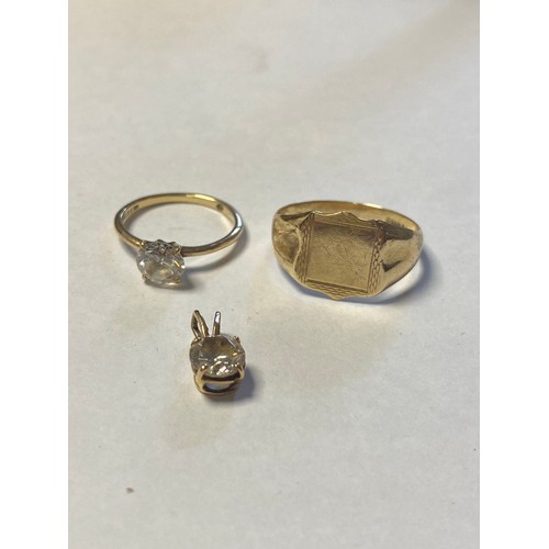 49 - A 9ct gold signet ring, together with a 9ct CZ solitaire ring and a similar pendant -