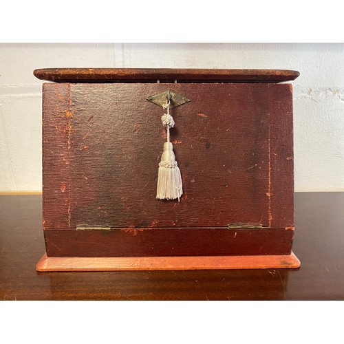 62 - A red morocco covered table top stationery box, with fall front to reveal writing slope and fitted i... 