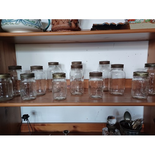 82 - A group of thirteen mid 20th century Kilner jars, sizes from 1lb - 3lb -