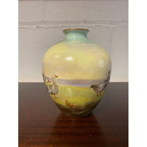 92 - A Royal Doulton vase, painted with a landscape scene of a lady and her geese -