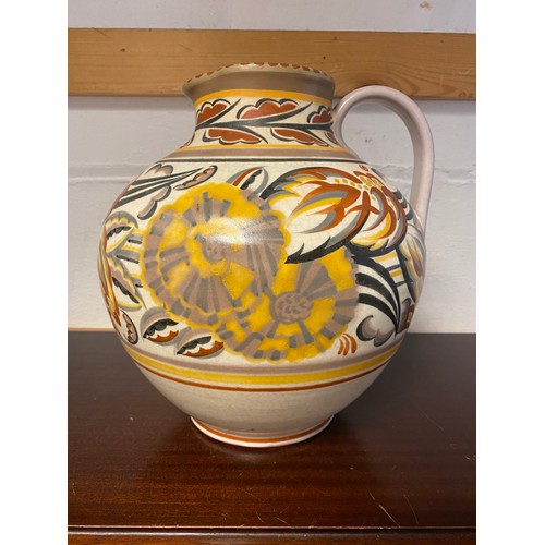 93 - A large Poole Pottery Carter Stabler Adams jug, painted with flowers and leaves, impressed mark and ... 