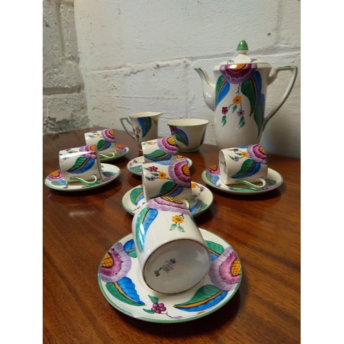 95 - A Crown Devon coffee service,
each piece decorated with flowers -