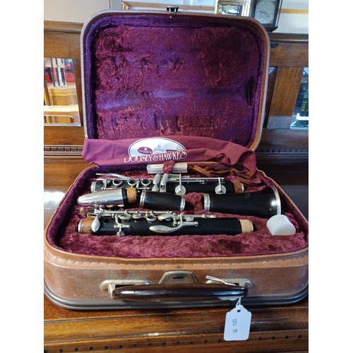 179 - A cased Boosey & Hawkes 'fogware' clarinet -