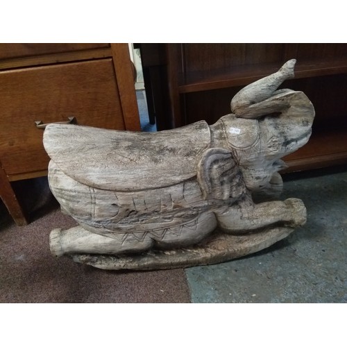 342 - A carved wooden rocking elephant -