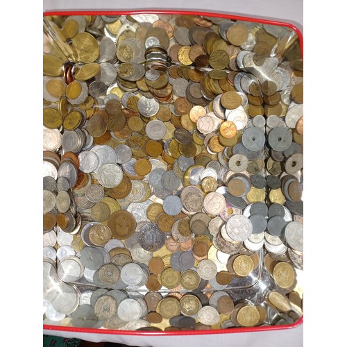 157 - Coins: a tin of World coins -