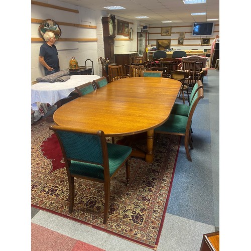 277 - An oak extending dining table, from Brights of Nettlebed, the rounded top with two additional leaves... 