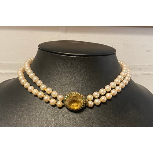 20 - A two row cultured pearl choker necklace, the graduated pearls to oval seed pearl and citrine clasp ... 