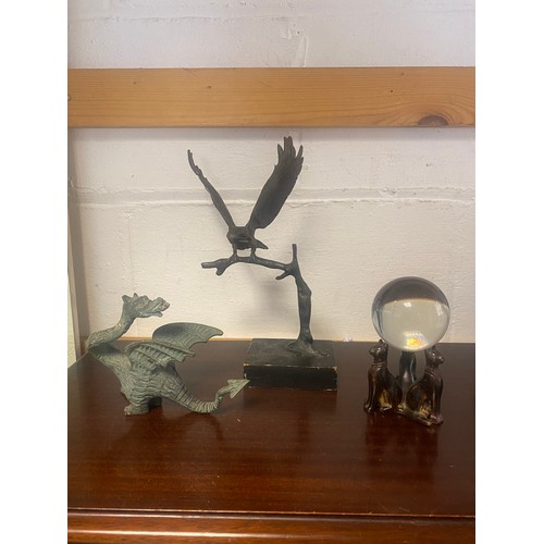 206 - A 20th century bronze of an eagle on branch, together with a dragon (a/f), three bronze cats, cast a... 