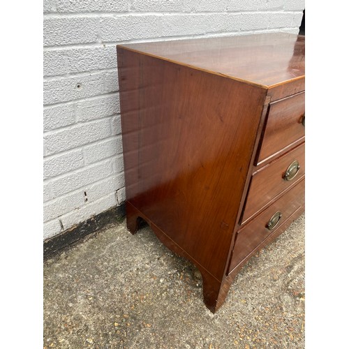 309 - A 19th century mahogany and boxwood strung chest of drawers, of small size, fitted with three long d... 