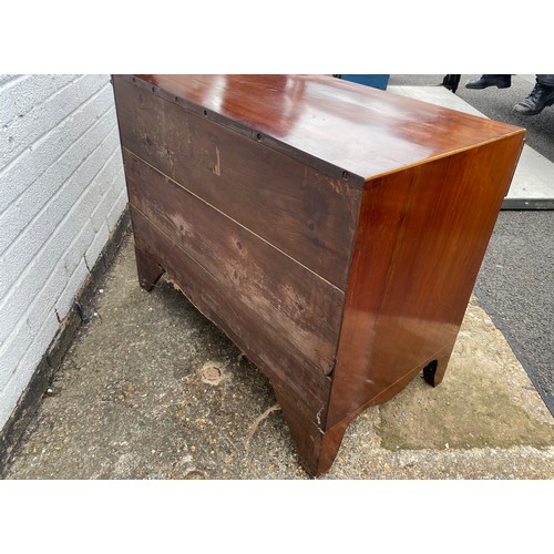 309 - A 19th century mahogany and boxwood strung chest of drawers, of small size, fitted with three long d... 