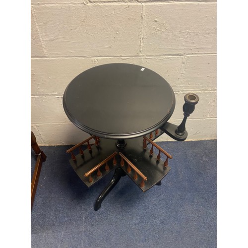 362 - A late Victorian ebonised revolving book table, with circular top, galleried shelf and candlestick, ... 